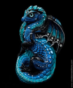 Small sculpture of a young blue dragon